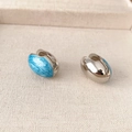 Oval silver earrings with sky blue enamel sand texture in a modern minimalist design - Blue