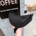 Minimalist black nylon half-moon crossbody bag with adjustable wide fabric shoulder strap - Black