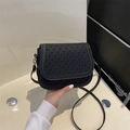 Classic black woven saddle bag with vintage texture and adjustable leather strap - Black