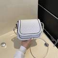 White woven texture saddle bag with black trim and elegant adjustable shoulder strap - White