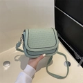 Mint green woven texture crossbody saddle bag with black trim and slim shoulder strap - Green