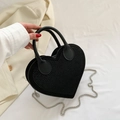 Black heart-shaped crossbody bag with silver studs and chain strap detail - Black