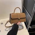 Bruine kunstleren crossbodytas met zwart cirkelpatroon en een verstelbare schouderriem - Bruin