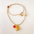 Handwoven necklace featuring a golden elephant pendant and a vibrant red bead accent - Gold Elephant Woven Necklace (Approx 63cm)