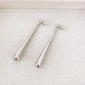 Minimalist silver long teardrop earrings with mirror polished finish on textured background - Silver