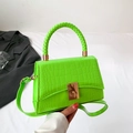 Neon green crocodile texture handbag with woven handle and golden metallic lock - Green