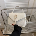 Cream white faux leather handbag with crocodile texture and gold hardware detail - White