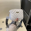 White quilted crossbody camera bag with adjustable wide black and white woven strap - White