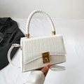 White faux crocodile skin crossbody bag with gold twist lock and woven handle - White