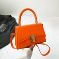 Bright orange crocodile pattern handbag with woven handle and golden metal lock - Orange