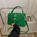Emerald green crocodile pattern crossbody bag with gold buckle and top handle - Green
