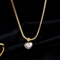 Gold herringbone chain necklace featuring a white shell heart pendant with Love engraving - Gold-White Mother Of Pearl Heart