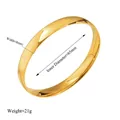 Detailed view of gold titanium steel bangle with 8mm width and 65mm inner diameter - Inner Diameter approx 65mm / Gold