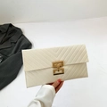Chic cream-colored V-quilted faux leather clutch bag featuring a sleek gold buckle closure - White