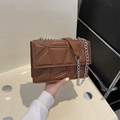 Brown quilted crossbody bag with geometric stitching and silver metal chain strap - Brown