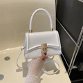 White faux leather crossbody bag with woven handle and gold metal twist lock - White