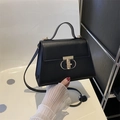 Classic black leather square handbag with golden metal lock and top handle - Black