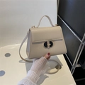Elegant cream square handbag with gold twist lock and adjustable shoulder strap for women - Khaki