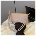 Detail of beige faux leather handbag with crocodile pattern and knotted strap accents - Khaki