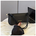 Détail du sac à main noir à motif crocodile avec des finitions en métal doré - Noir