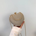 Pochette a cuore oro champagne scintillante con manico tondo in metallo e tracolla - Oro