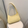 Minimalist pale yellow leather underarm baguette bag with fixed shoulder strap - Yellow
