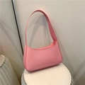 Chic light pink baguette shoulder bag with minimalist curved design and sleek PU leather - Pink