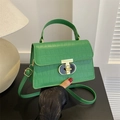 Elegant green crocodile pattern handbag with gold metal clasp and adjustable strap - Green