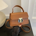 Brown crocodile texture handbag with gold rotating lock and adjustable crossbody strap - Brown