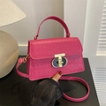 Hot pink crocodile textured handbag with golden twist lock and versatile strap - Rose Pink