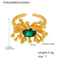 Detailed macro view of an adjustable gold ring with a green oval zircon and radial beads - US 7 / Ring / Green