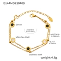 Detail eines 18k vergoldeten Doppelarmbands mit schwarzem Zirkon und weißer Muschel - Römische Ziffer Doppellagiges Goldarmband (16+5cm)