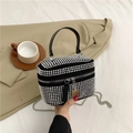 Chic black mini bag with silver rhinestones and chain strap on neutral blazer background - Silver