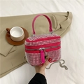 Rose red rhinestone crossbody bag with silver studs and chain strap in hand - Rose Red