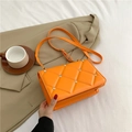 Bright orange quilted crossbody bag with rhinestone rivets and adjustable strap - Orange