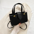 Bolso tote elegante de cuero sintético negro con textura de lichi y correa ajustable - Negro