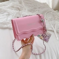 Elegant pink crossbody chain bag with wave flap design and silver fashion logo detail - Pink