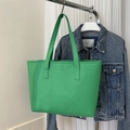 Detail of green tote bag with V-shaped quilting and matching long shoulder strap - Green Upright Chevron