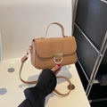 Classic brown faux leather crossbody bag with elegant gold and white ring lock hardware - Khaki