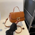 Chic caramel brown square handbag with golden horseshoe lock and adjustable strap - Brown