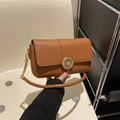 Caramel brown leather crossbody flap bag with golden circular hollow buckle and chain strap - Brown