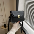 Classic black matte leather crossbody bag with a unique artistic gold metal lock buckle - Black