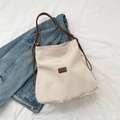 Cream canvas tote bag with brown leather straps and a vintage denim jacket accent - Off White