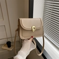 Beige faux leather crossbody bag for women with golden rectangular metal lock closure - Khaki