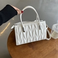 White faux leather crossbody bag with V-shaped quilted design and silver hardware - White