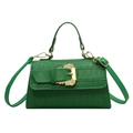 Deep green crocodile embossed handbag with luxury gold baroque buckle in front view - Green