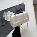Minimalist white leather shoulder bag with gold metal trim and fashion lettering - Off White