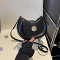Minimalist black matte leather half-moon saddle bag with round golden metal buckle - Black