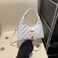 White quilted crescent handbag with gold hardware and versatile crossbody strap - White