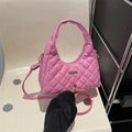 Chic pink quilted shoulder bag with gold hardware and long crossbody strap detail - Pink